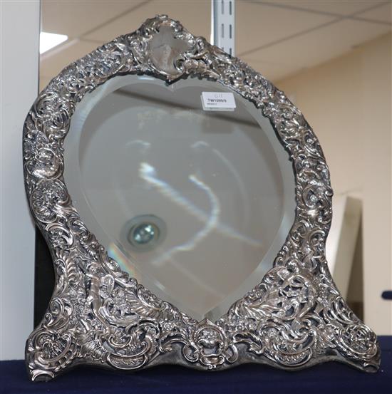 A late Victorian silver-mounted easel toilet mirror with heart-shaped plate, H 44cm